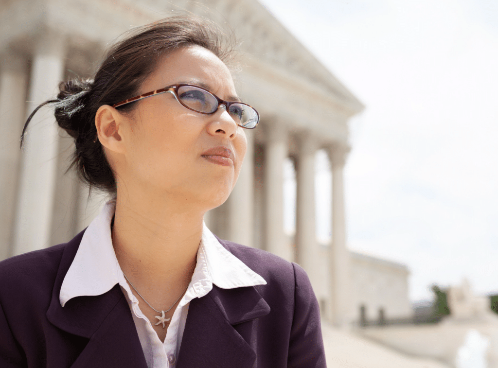 Woman Outside of a Courthouse